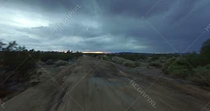 Camera backing up on desert road