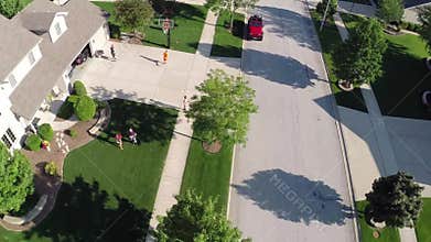 Flying over residential houses and yards along suburban street - Travel and leisure concept