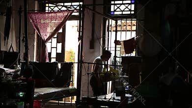 An unidentified man works at an old hotel