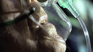 Breathing mask on senior patient's face
