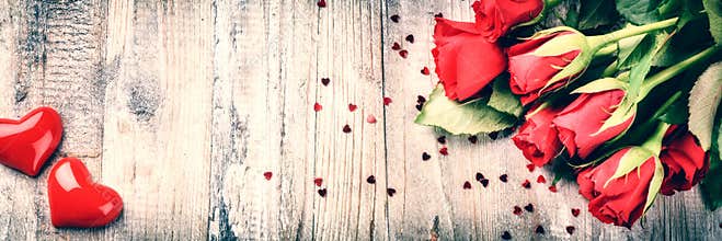 Bouquet of red roses with decorative heart. St Valentine's conce