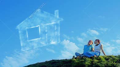 Young couple dreaming on the hill