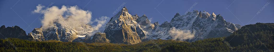 The Aiguilles mountain range peaks and blue sky. Chamonix, France
