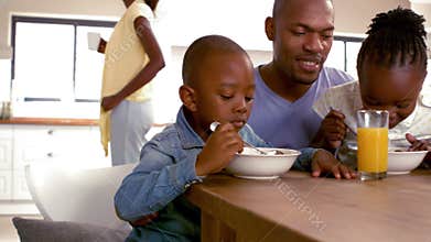 Happy family having breakfast together in the morning