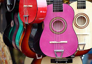 Colorful guitars in musical instruments shop