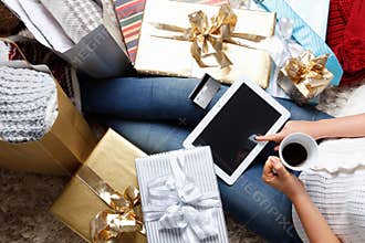 Woman shopping online with a credit card