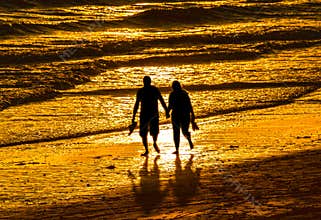 Couple walking on beach