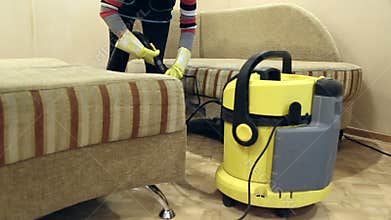 Service cleaning dirty sofa and chairs with special tool