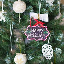 Christmas tree with Happy holidays sign
