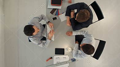 Architects in office looking at construction