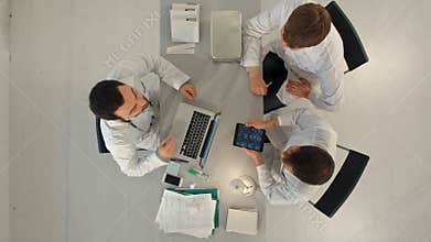 Group of happy doctors with tablet pc computers