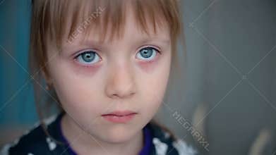 The sad sight of a little girl