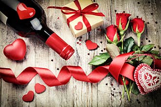 St Valentine's setting with red roses bouquet, present and red w