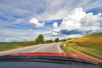 Speed Car Driving in Curve on Nature Freeway