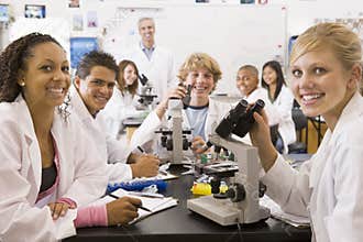 School children and their teacher in science class