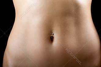 A tummy of the young woman