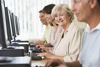 Adult students on a computer