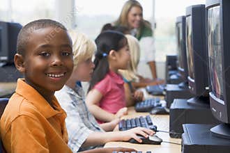 Kindergarten children learning to use computers