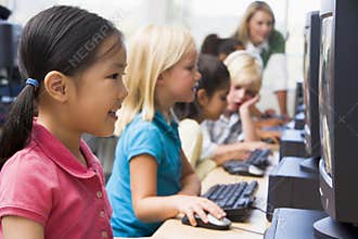 Children learning how to use computers.
