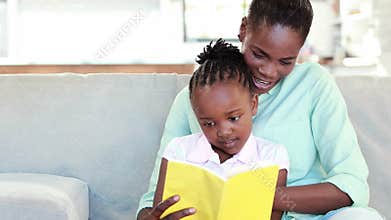 Mother and daughter reading a book