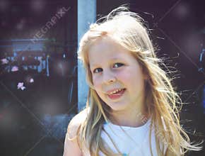 Portrait of a little blonde smiling girl; soft retro style
