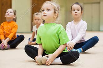 Kids doing exercise in gym