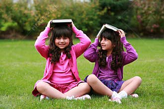 Girls with books on head