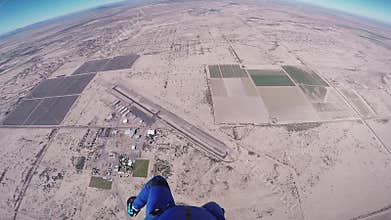 Skydiver girl open parachute above Arizona. Flight. Sunny day. Extreme sport.