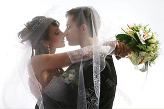 Kissing couple wedding portrait