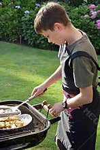 Boy doing barbecue