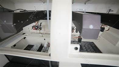 High-tech robotic pharmaceutical, medical machine automatically working in modern lab.