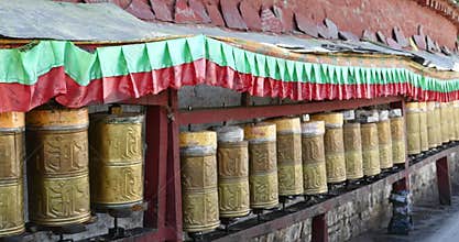 4k tibet women spin buddhist prayer wheels at Potala,lhasa.