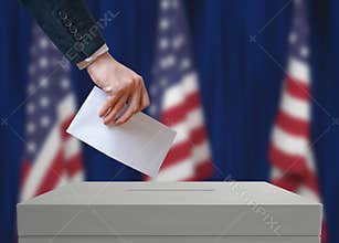 Election in United States of America. Voter holds envelope in hand above vote ballot.