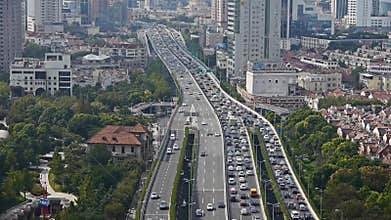 Time lapse,long heavy traffic on highway,Shanghai business building skyscraper.