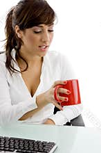 Front view of attorney looking at coffee mug