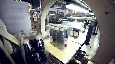 Automated Production line. Pop and Soda bottle packing conveyor.