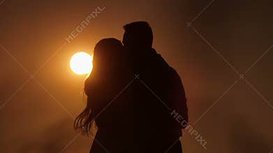 Beautiful Young Couple in Love kiss in the sun
