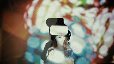 Little girl using VR-helmet. vr dance simulator