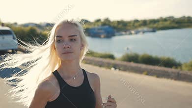 Athletic Woman Running near the Beach. Female Runner Jogging. Outdoor Workout.