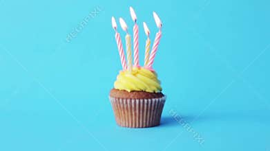 Birthday cupcake with five burning candles