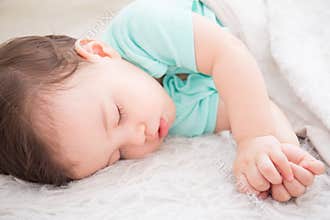 Baby sleep on the bed