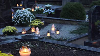 Candles burning at a cemetery during all saints day. 4K