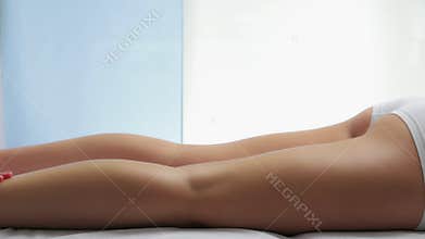 Therapeutic female leg massage.