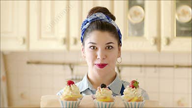 Young girl presenting cakes