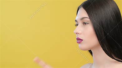 Woman makes silence gesture