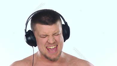 Guy with headphones listening to music. White. Slow motion