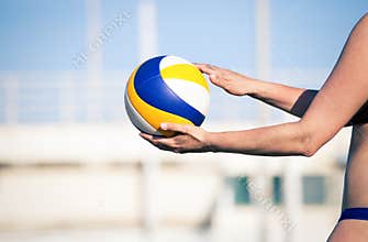 Beach volleyball player, playing summer. Woman with ball