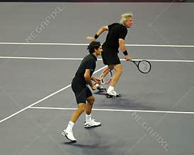 Roger Federer and Bjorn Borg in actions