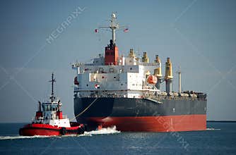 Cargo Ship With Tug