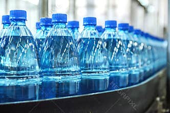 Closeup on mineral water bottles in raw and lines